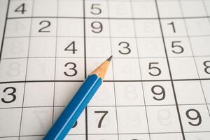Sudoku puzzle game playing challenge brain. photo