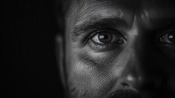 Intense Close-Up of a Male Face Highlighting Unique Skin Texture and Expression photo