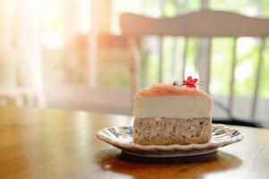 Piece of homemade taro cake in classic plate on table with copy space for text photo