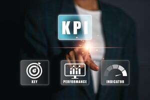 Businessman interacting with KPI interface, highlighting key performance indicators for business success. photo