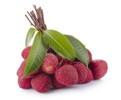 Fresh lychees and green leaves isolated on a white background photo