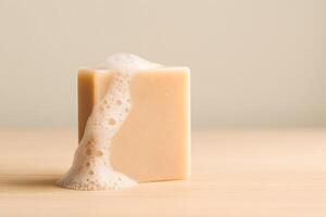 A soap bar with soap foam on top of it photo