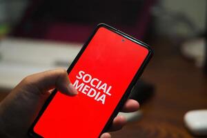 Concept of a Person's Hand Scrolling Through Social Media, Illustrating the Negative Impacts of Social and Internet photo