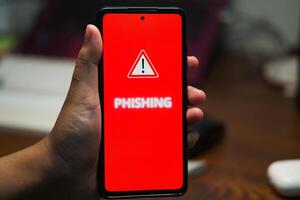 Mobile Phone Displaying Phishing Alert Message as a Cyber Security Warning photo