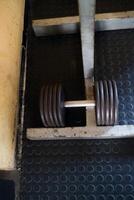 Close Up of a Barbell with Weights in a Gym photo