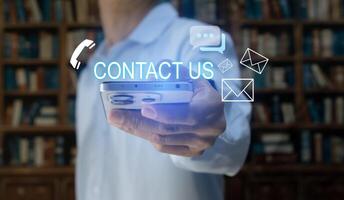 Contact us or our customer support hotline where people connect. and touch the contact icon on the virtual screen. photo