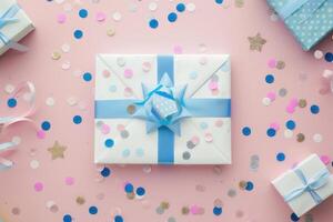 A gift box with a blue bow is surrounded by confetti photo