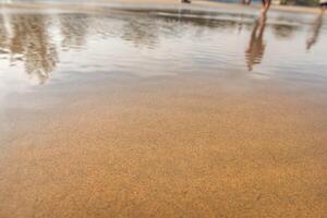 waves crash in the beach sand for background photo
