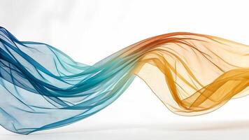 Flowing sheer fabric transitions from deep blue to warm orange against a white background photo