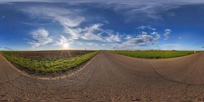 360 panorama of a road in the middle of a field photo