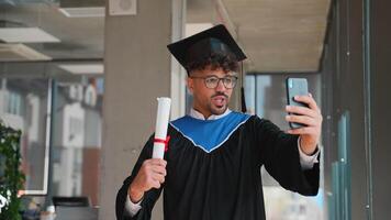 Happy graduate making a call holding diploma video