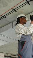 Technician installing air conditioning system in building video