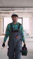 Painter walking in building under construction video