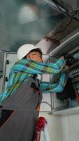 Electrician working on electrical panel installing new components video