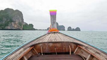 Boat travels towards island in serene ocean setting video