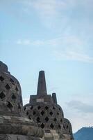 Close up Stone Stupa of Borobudur Temple with Clear Sky Scenery photo