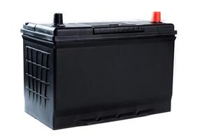 Black car battery with red and black terminals, isolated on white background. Used for automotive power supply and engine starting. photo
