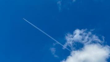 Jet stream whispers across azure skies, dreamlike voyage, fleeting footprints celebrate Flight of Dreams Days ethereal wonders photo