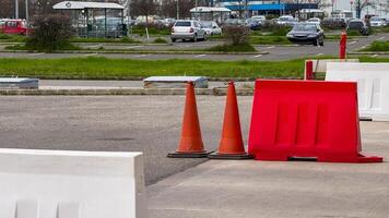 Parking lot obstacle maze with vibrant cones and barriers, urban planning challenges, foresee infrastructural Balinese Galungan innovation photo