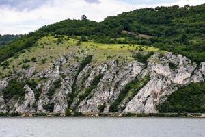 Craggy limestone cliffs embrace verdant slopes, whispering tales of Earths quiet rebellion celebrate Earth Day and Geologists Day photo
