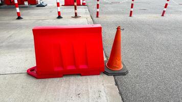 Red barricades contrast pavements grayscale for a parking odyssey think urban festivals or peculiar Barrier Awareness Day photo