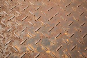 Rusty metal texture with corrosion spots and fine scratches, seamless layout. photo