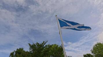 Scottish flag waving against a cloudy sky video