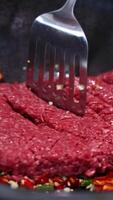 Beef is stir-fried with vegetables in a pan, showcasing vibrant colors and dynamic cooking action video