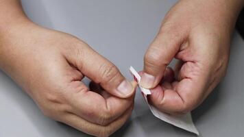 Sequential steps of opening a sterile bandage video