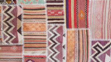 Patch texture of traditional Turkish ethnic patterned carpet closeup photo
