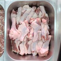raw duck wings stick on stainless tray photo