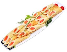 A platter of rolls with salmon and vegetables photo