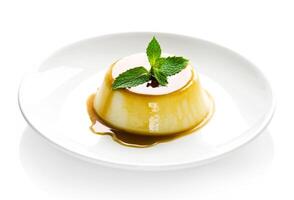 Flan with caramel sauce on white plate photo