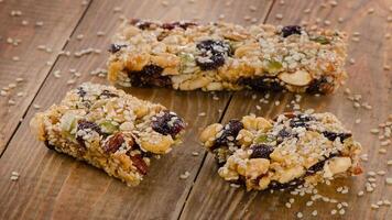 A close up of some granola bars on a wooden table photo