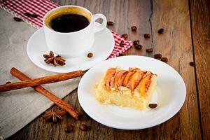 Coffee Cup with Apple Pie on Woody Backfround photo