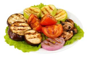 Delicious grilled vegetables on plate isolated on white photo