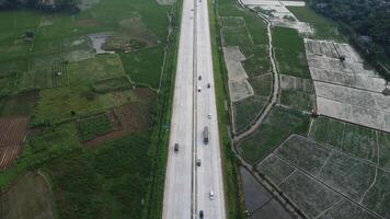Urban landscape of cars driving on a highway with blurred motion capturing the speed of travel on the asphalt road at dusk photo