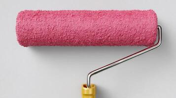 Pink Paint Roller on a White Wall DIY Home Improvement and Interior Decoration photo