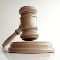 Elegant wooden gavel resting on a smooth surface in a neutral setting photo