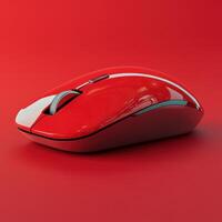 Vibrant red computer mouse resting on a smooth red surface with sleek design photo