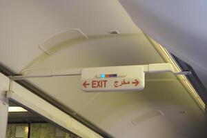 Sign indicating exit on an aircraft during flight photo