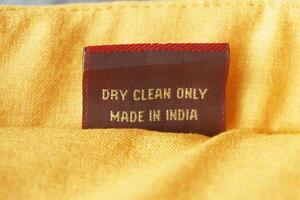 Care label showing dry clean instructions on fabric photo