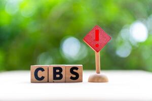 CBS is acronym Cell Broadcast Service, emergency warning system that sends a warning message directly to mobile phone on table photo