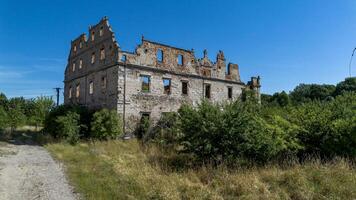 Half-ruined ancient castle, German building in Poland, Mietkow, Borzygnev, Drone view photo