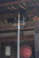 Traditional wooden architecture with lanterns and intricate detail. photo