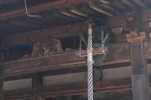 Traditional wooden architecture with lantern and intricate detail. photo
