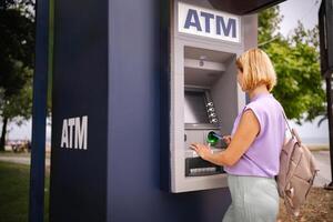 Exploring summer in Greece while visiting a local ATM photo