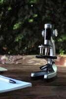 Microscope on a wooden table photo