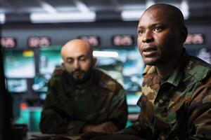 Military personnel in command center photo