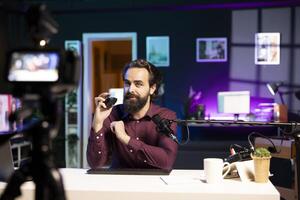 Man in stylish studio with camera photo